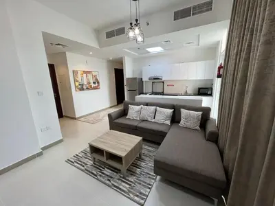 a living room with a couch and a coffee table at Binghatti Gateway 2BHK At Jaddaf By al Sarya Holiday Home in Dubai