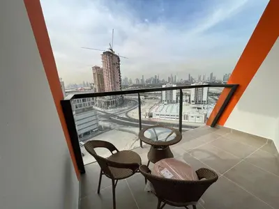a balcony with chairs and a view of a city at Binghatti Gateway 2BHK At Jaddaf By al Sarya Holiday Home in Dubai