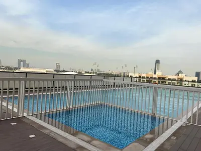 a swimming pool on the roof of a building at Binghatti Gateway 2BHK At Jaddaf By al Sarya Holiday Home in Dubai