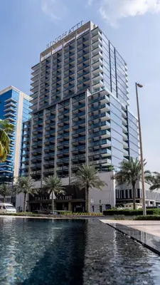 a large building with a pool in front of it at Business Bay Studio Jacuzzi & Iconic View in Dubai