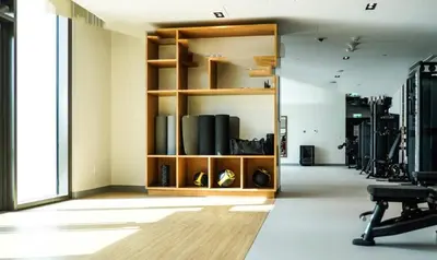 a room with a shelf with shoes on it at Modern 2BR at Burj Crown Walk to Burj Khalifa by Vibel Stay in Dubai