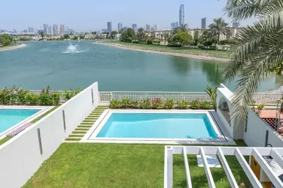 a swimming pool in the middle of a body of water at Luxury Villa with Pool and Garden 4BR The Springs in Dubai