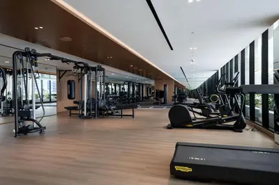 a gym with treadmills and cardio equipment in a building at Canal-view Studio Jacuzzi Business Bay in Dubai