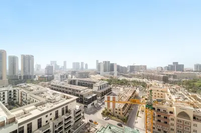 an aerial view of a city with tall buildings at Silkhaus New 1BDR Retreat at Binghatti Tulip in JVC in Dubai