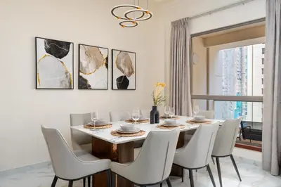 a dining room with a table and chairs at GuestReady - Premium stay in JBR walk in Dubai