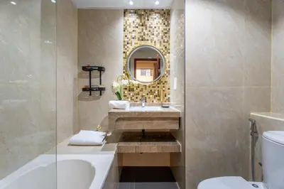 a bathroom with a sink and a mirror at GuestReady - Premium stay in JBR walk in Dubai