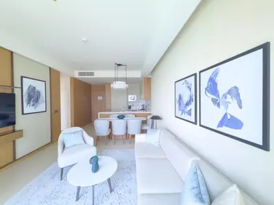 a living room with a couch and a table at ADDRESS Residences Opera 2BR Tower 1 - EPIC 30th floor Burj Khalifa view byBLCK with DXB AIRPORT VIP Shuttle option in Dubai
