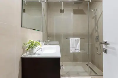 a bathroom with a sink and a shower at 3BR Apartment in the heart of Dubai Marina in Dubai