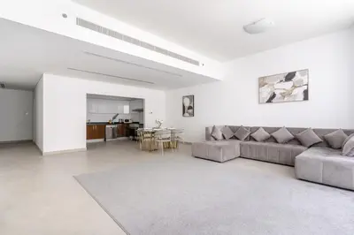 a living room with a couch and a table at 3BR Apartment in the heart of Dubai Marina in Dubai