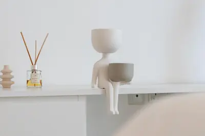 a white figurine on a shelf in a room at 3BR Apartment in the heart of Dubai Marina in Dubai