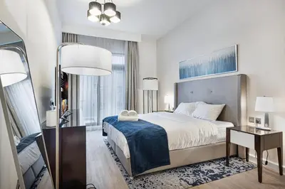 a hotel room with a large bed and a window at Modern 1BR in Avanti with Pool & Gym in Dubai