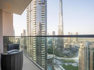 a view of a city from a balcony in a building at Burj Views Elegance from 3 Bedroom Apartment 214-A1-3 in Dubai