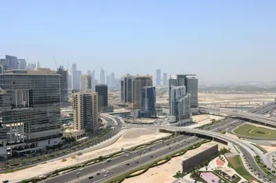 an aerial view of a city with traffic at Centrally Located 1BR in Business Bay Near Canal and Downtown in Dubai