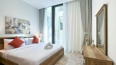 a bedroom with a large bed and a large window at Resort-Style 1BR in Dubai Creek Harbour -1AB01 in Dubai