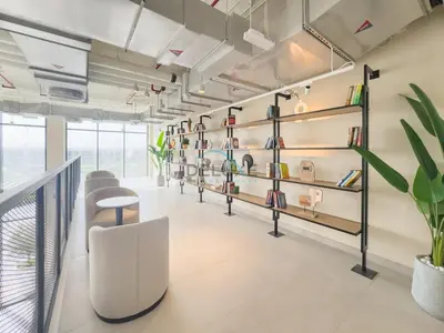 a room with shelves of shoes on the wall at New Studio Close to Town Square Park, Short Drive to Al Qudra Lake, Liva Apartments by Deluxe Holiday Homes in Dubai