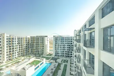 an aerial view of a city with tall buildings at New Studio Close to Town Square Park, Short Drive to Al Qudra Lake, Liva Apartments by Deluxe Holiday Homes in Dubai