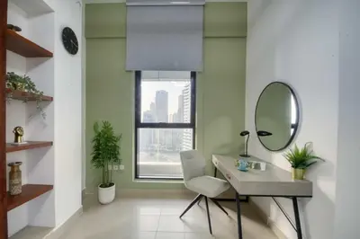 a room with a mirror and a desk and a mirror at Elegant Cozy Marina Home in Dubai