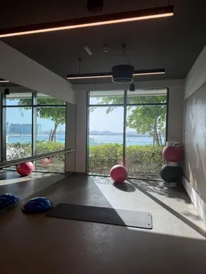 a room with a yoga room with a view of the ocean at Blue Horizon Living in Dubai