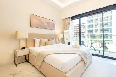 a bedroom with a large bed and a large window at Pool and Community View Studio, Near Top Landmarks, Azizi Riviera 59, Al Merkadh by Deluxe Holiday Homes in Dubai