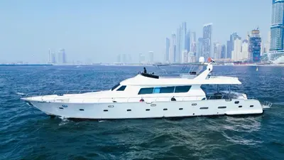 a white boat in the water with a city at Riviera Leisure Yachts Dubai in Dubai