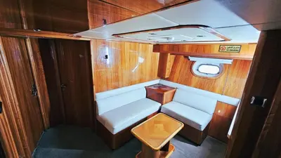 a small room with a white seat in a boat at Riviera Leisure Yachts Dubai in Dubai