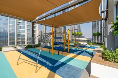 a playground on the roof of a building at High-Rise & Boulevard View - 5-min to Burj & Mall in Dubai