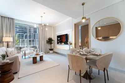 a living room with a table and chairs and a couch at Luxurious 1BR Pool with Burj Khalifa View Dubai Mall in Dubai