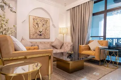 a living room with a couch and a table at Upgraded 2bdr with acess to Dubai Mall in Dubai