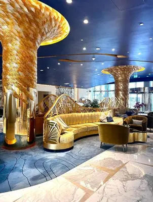a lobby with a couch and chairs in a building at Damac Prive in Dubai