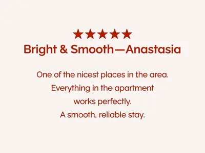 a line with five stars with the words bright and smoothassasia one at Stylish Lakefront Studio with King Bed and Balcony in Dubai