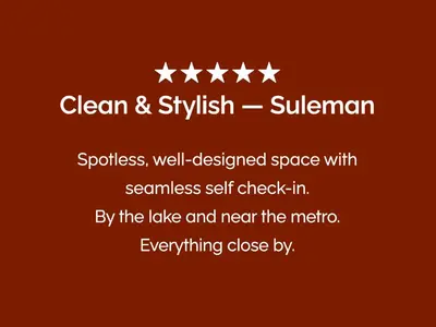 a poster with four stars on a red background at Stylish Lakefront Studio with King Bed and Balcony in Dubai