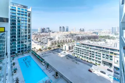 a view of a city from a building at FAM Living Minimalist 1BR Gem in Binghatti Amber in Dubai