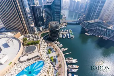 an aerial view of a city with boats in the water at The Classy in Dubai