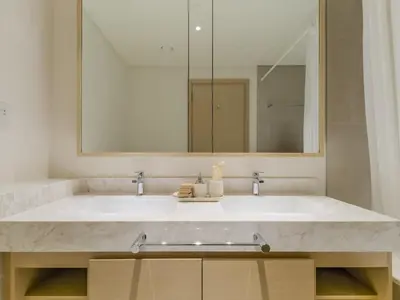 a bathroom with a large sink and a mirror at TRPS - Creek Rise Tower, Dubai Creek Harbour - 3BR with Marina View in Dubai