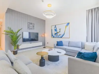 a living room with a couch and a table at TRPS - Creek Rise Tower, Dubai Creek Harbour - 3BR with Marina View in Dubai