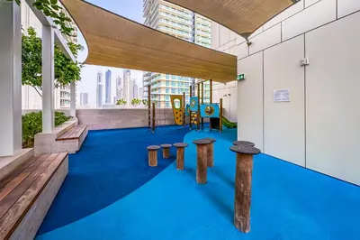 a play area with a playground in a building at Sea View 2BR Apartment in Beach Vista 2 in Dubai