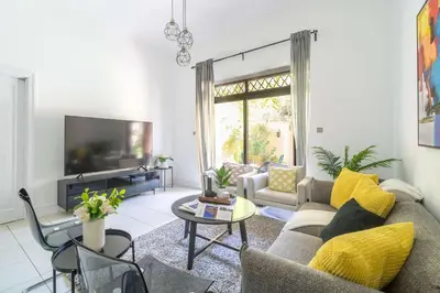 a living room with a couch and a tv at Frank Porter - Zaafaran 4, Old town, Downtown Dubai in Dubai