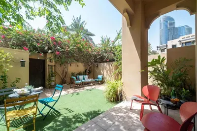an outdoor patio with chairs and a table with a table at Frank Porter - Zaafaran 4, Old town, Downtown Dubai in Dubai