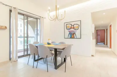 a dining room with a table and chairs at Seashell stunning 2 bedrooms in JBR in Dubai
