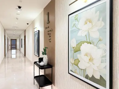 a hallway with a painting of flowers on the wall at Creek New Luxury Stay Beach and Lagoona Access in Dubai