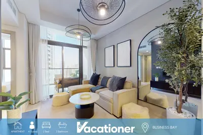 a living room with a couch and a table at Vacationer I Luxury 2 Bedroom Apartment I Business Bay, Near Dubai Canal I Aykon City Tower 2 in Dubai