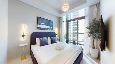 a bedroom with a large bed and a large window at Vacationer I Luxury 2 Bedroom Apartment I Business Bay, Near Dubai Canal I Aykon City Tower 2 in Dubai