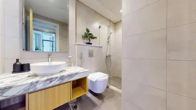 a bathroom with a sink and a toilet and a shower at Vacationer I Luxury 2 Bedroom Apartment I Business Bay, Near Dubai Canal I Aykon City Tower 2 in Dubai