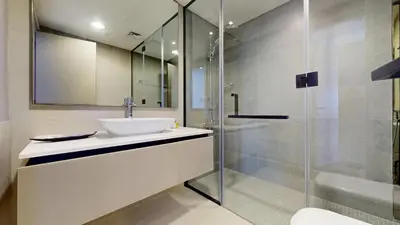 a bathroom with a sink and a shower at Vacationer I Steps to Metro I Premium 2 Bedroom Apartment I Yacht Bay Marina in Dubai