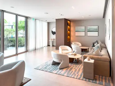 a living room with a couch and chairs and tables at GRANDE SIGNATURE with a direct Burj Khalifa view and Private Fountain Show with DXB AIRPORT VIP Shuttle option for 6 guests in Dubai