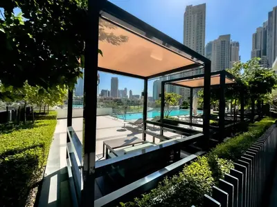 a pavilion with a swimming pool in a park at GRANDE SIGNATURE with a direct Burj Khalifa view and Private Fountain Show with DXB AIRPORT VIP Shuttle option for 6 guests in Dubai