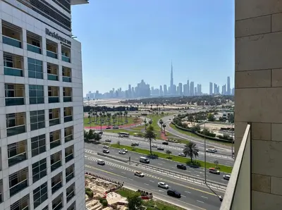 a view of a highway with a city in the background at Brand New , Skyline View in Dubai