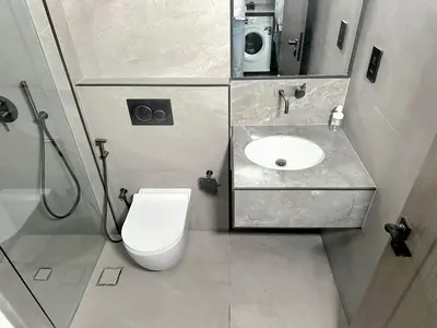 a bathroom with a toilet and a sink at Brand New , Skyline View in Dubai
