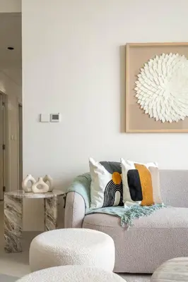 a living room with a couch and a table at Luxurious 4BR with Boulevard View - 10 min to Burj & Mall in Dubai