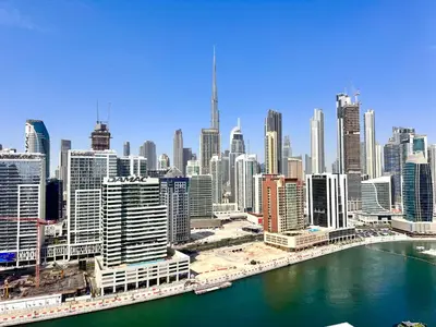 an aerial view of a large city with a river at Luxury Apartment Burj Khalifa View Summer Offer in Dubai